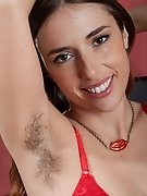 Simone strips nude while sitting at her desk